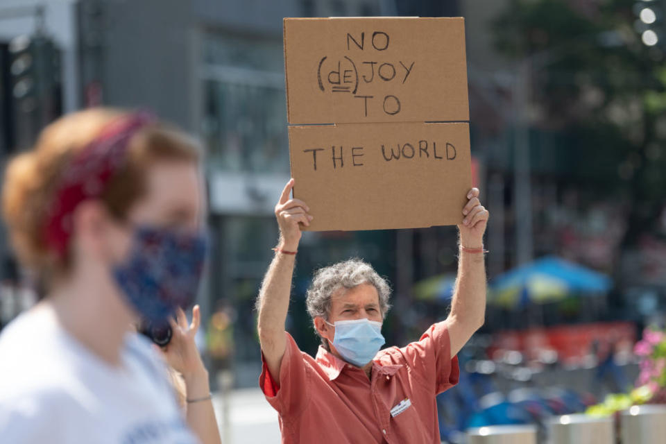 A man at the "Save The Post Office" rally outside a post office building on August 25, 2020 in New York City.<span class="copyright">Alexi Rosenfeld—Getty Images</span>