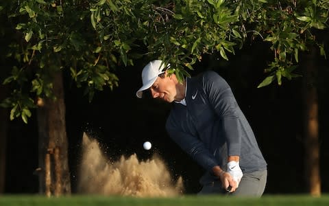 Rory McIlroy hits out of a bunker - Credit: Getty images