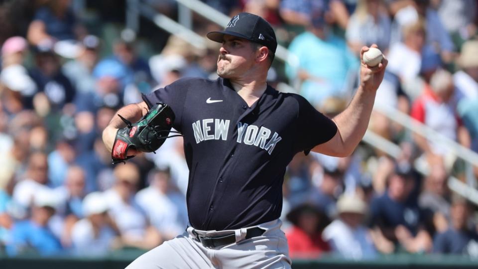New York Yankees starting pitcher Carlos Rodon (55) throws a pitch during the first inning against the Atlanta Braves.