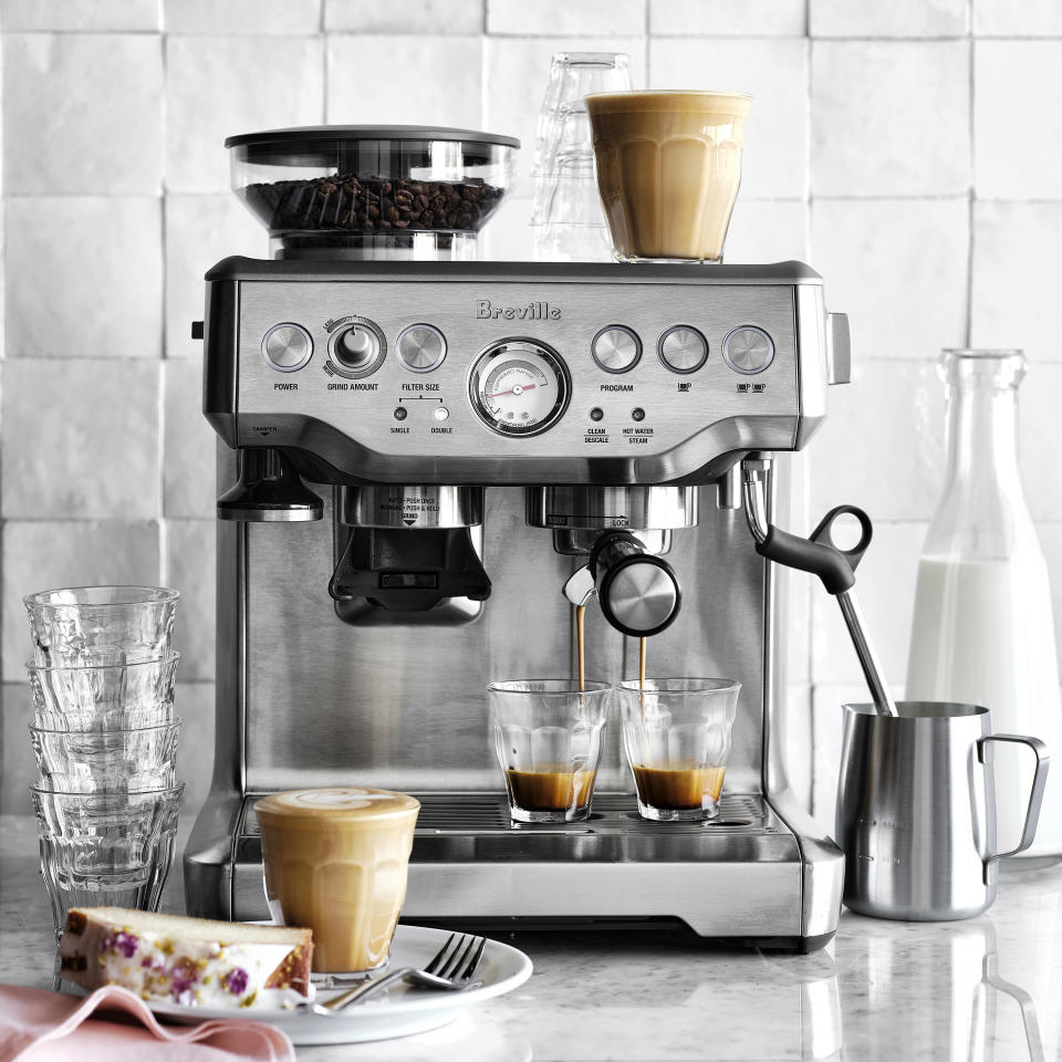 This image provided by Williams-Sonoma shows Breville's Barista Express Espresso Machine. For those who want to step up into pro brewing territory, sophisticated machines include Breville's Barista Express espresso machine. It has a 15-setting bean grinder, built-in tamper, bean storage compartment, extraction pump, multi-angled steam wand for milk frothing — even a water extractor so the grounds become a dry puck for disposal. (Williams-Sonoma via AP)