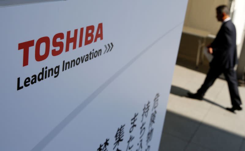 The logo of Toshiba is seen as a shareholder arrives at Toshiba's extraordinary shareholders meeting in Chiba