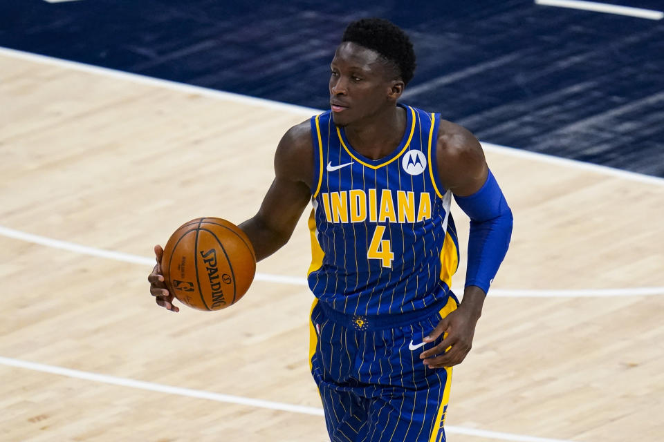 Indiana Pacers guard Victor Oladipo (4) plays against the Cleveland Cavaliers during the first half of an NBA basketball game in Indianapolis, Thursday, Dec. 31, 2020. (AP Photo/Michael Conroy)