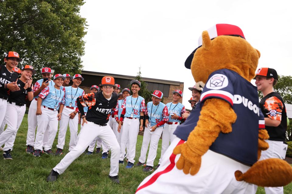 Smithfield's Brayden Castellone dances with mascot "Dugout" at the World Series Picnic at Pennsylvania College of Technology on Monday in Williamsport, Pa.. The picnic featured major league baseball Hall of Famer Ryne Sandberg.