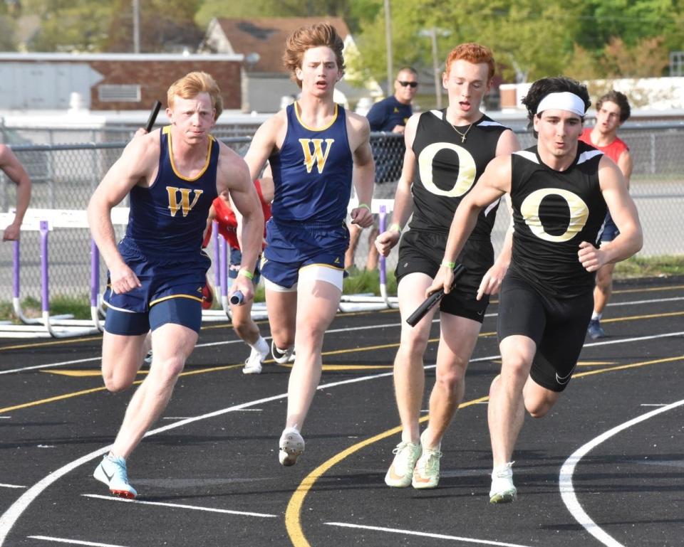 Shea Ruddy (left) gets the baton from his brother and Whiteford teammate Ryin Ruddy during the Tri-County Conference Championships. The brothers, who have not run track since middle school, have both qualified for the state finals in four events.