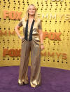 Amy Poehler wore a gold jumpsuit by Greta Constantine. [Photo: Getty]