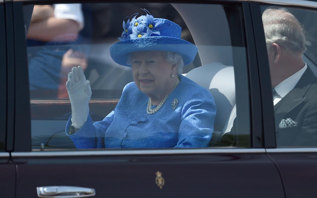 The Queen, recklessly travelling without a seat belt. - REUTERS