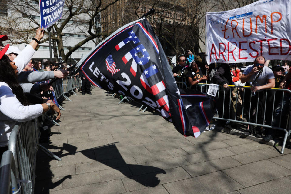 Supporters and opponents of former President Donald Trump are kept apart outside of the Manhattan Criminal Court before his arraignment on April 4.