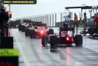 Hungary Formula One - F1 - Hungarian Grand Prix 2016 - Hungaroring, Hungary - 23/7/16 Formula One drivers wait for their start on tarmac in front of the pit lane during qualification . REUTERS/Attila Kisbenedek