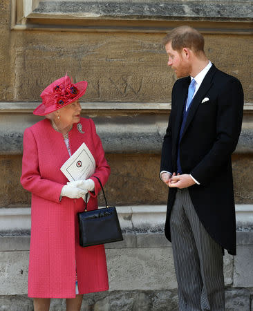 Queen Elizabeth II talks to Prince Harry as they leave after the wedding of Lady Gabriella Windsor and Thomas Kingston at St George's Chapel in Windsor Castle, near London, Britain May 18, 2019. Steve Parsons/Pool via REUTERS