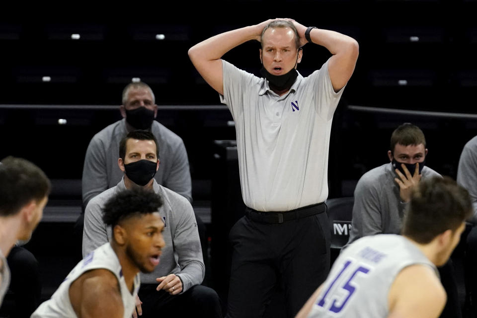 Northwestern head coach Chris Collins reacts as he watches his team during the first half of an NCAA college basketball game against Wisconsin in Evanston, Ill., Saturday, Feb. 21, 2021. (AP Photo/Nam Y. Huh)