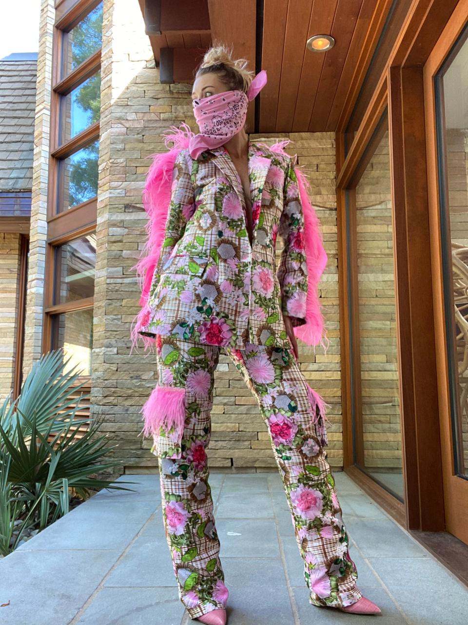 Martha Gottwald models the feathered jacket she created in 2020 that Kim Mulkey wore in the NCAA Tournament. Gottwald is founder, CEO and creative director of fashion company Neubyrne.