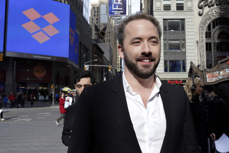 Dropbox co-founder Drew Houston at the Nasdaq MarketSite during the company's IPO, in New York's Times Square, Friday, March 23, 2018. (AP Photo/Richard Drew)