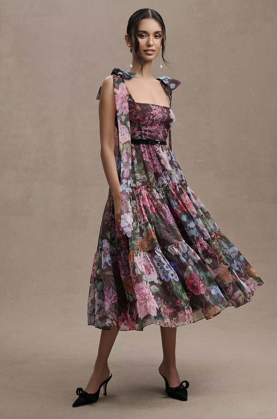 model wearing dark pink, black blue floral midi dress, BHLDN Isabella Tiered Square-Neck A-Line Midi Dress (photo via Anthropologie)