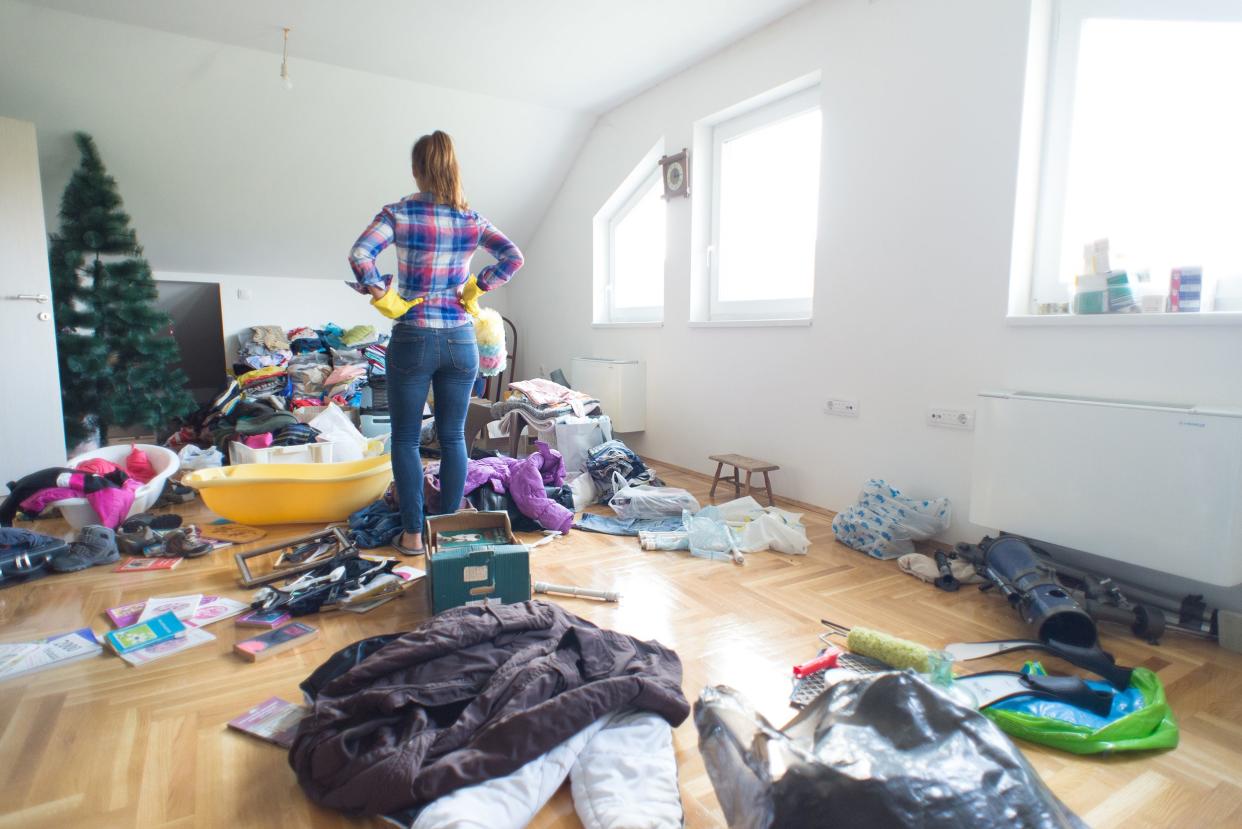 young housewife preparing for cleaning clutter at home