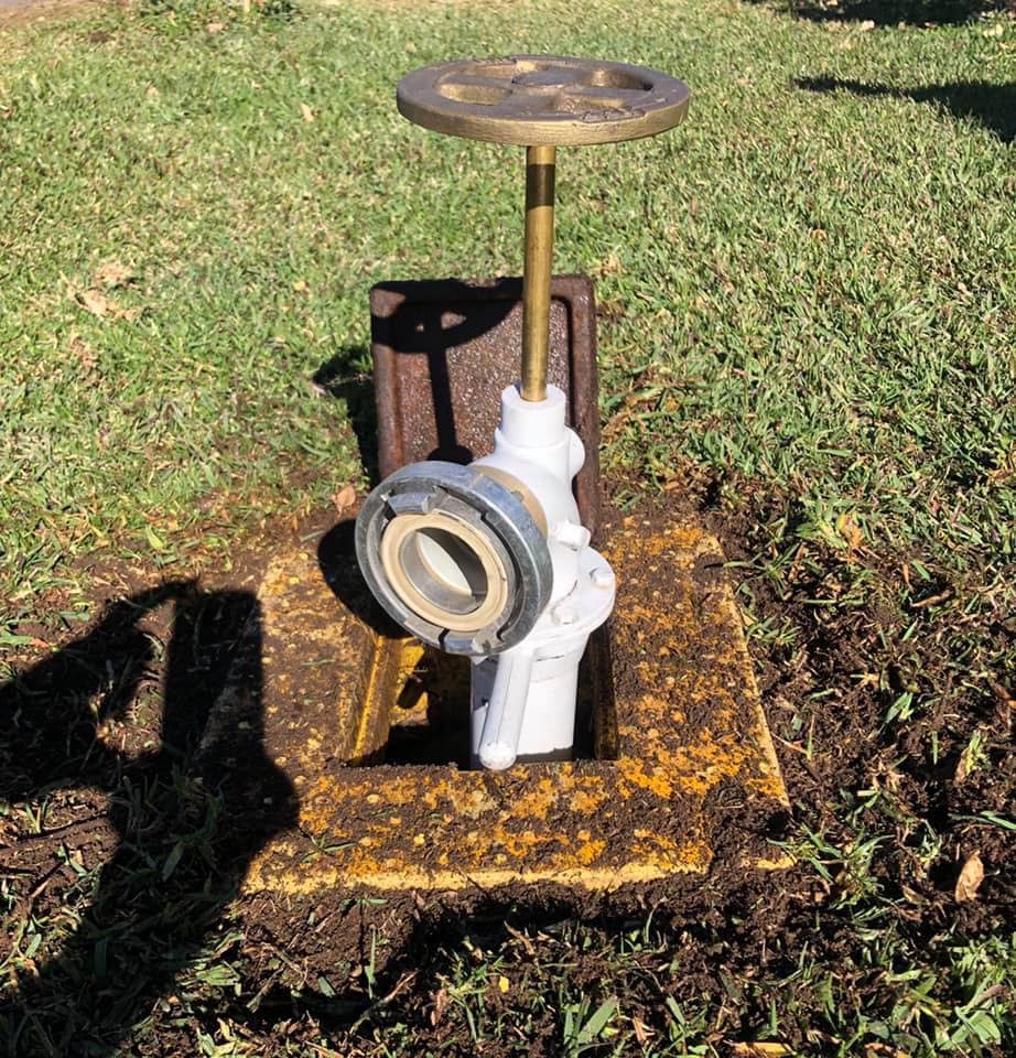 Pictured is the fire hydrant pulled out of the hatch in the middle of a lawn. 
