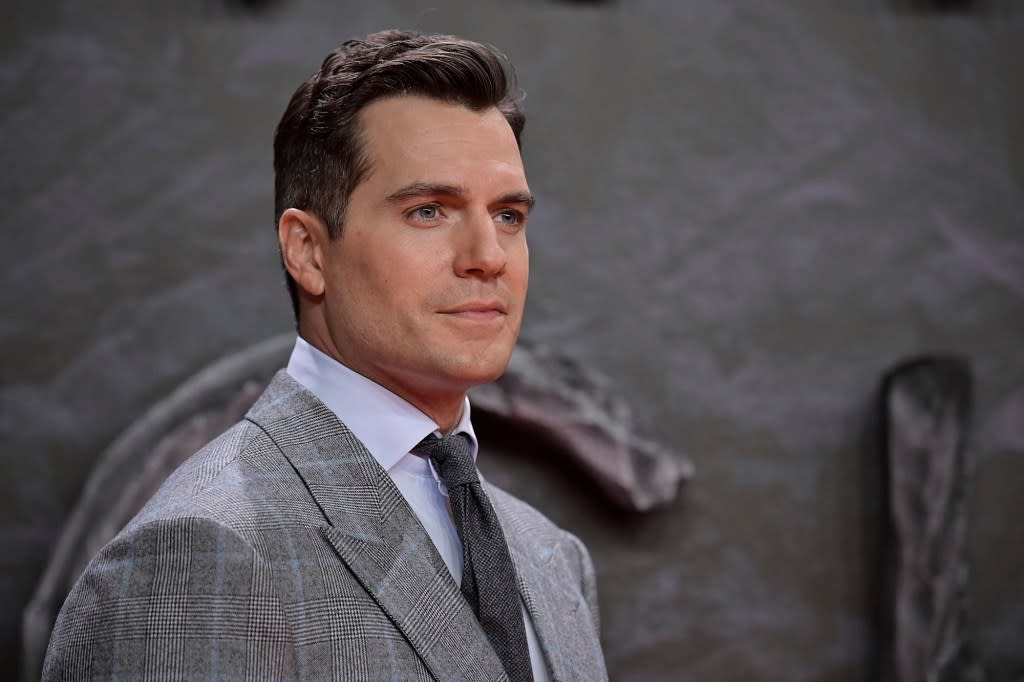 Some people claim that facial workouts, from face yoga to electroshock therapy, can give you a toned jawline like Henry Cavill (above) without going under the knife. Getty Images for Netflix