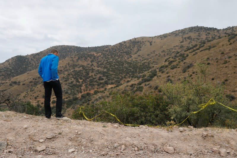 A relative of the Rhonita Miller-Lebaron and Dawna Ray Langford and their children who were killed by unknown assailants, looks at the crime scene during a journey to bury the Miller-Lebaron Family near Bavispe