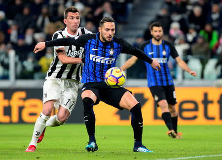 Soccer Football - Serie A - Juventus vs Inter Milan - Allianz Stadium, Turin, Italy - December 9, 2017 Inter Milan's Danilo D'Ambrosio in action with Juventus’ Mario Mandzukic REUTERS/Massimo Pinca