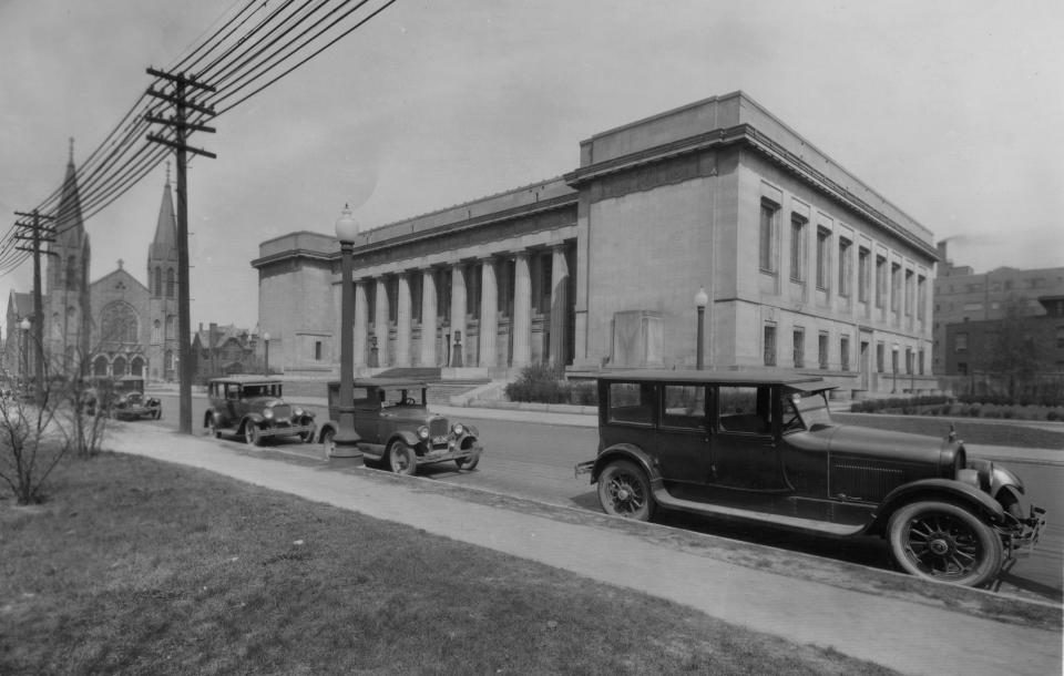 A 1928 photo of the Indianapolis Central Library on land donated by James Whitcomb Riley at St. Clair between Pennsylvania and Meridian Streets. The building was designed by Philadelphia architect Paul Cret, and was designed in a Greek Doric style fashion and constructed of Indiana limestone.