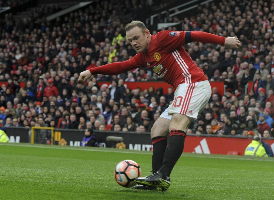 Manchester United's Wayne Rooney shoots at goal during the English FA Cup Third Round match between Manchester United and Reading at Old Trafford in Manchester, England, Saturday, Jan. 7, 2017. United won the match 4-0. (AP Photo/Rui Vieira)