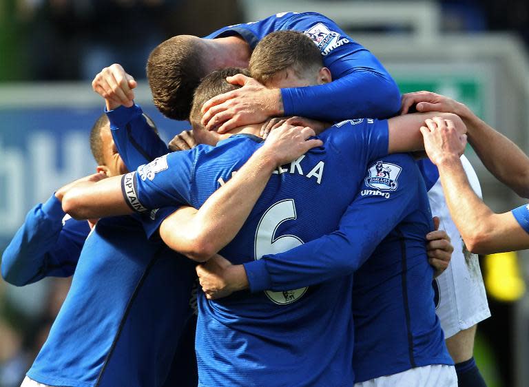 Everton's players celebrate scoring a goal during the English Premier League football match in Liverpool, UK on April 4, 2015