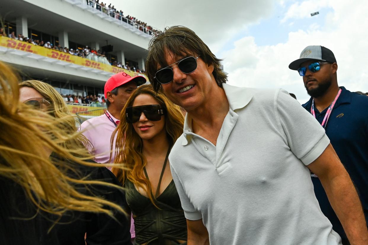 US actor Tom Cruise (R) and Colombian singer Shakira (L) attend the 2023 Miami Formula One Grand Prix at the Miami International Autodrome in Miami Gardens, Florida, on May 7, 2023. (Photo by CHANDAN KHANNA / AFP) (Photo by CHANDAN KHANNA/AFP via Getty Images)