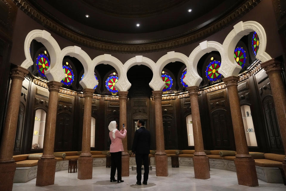 Guests tour the Sursock Museum's exhibitions after relaunching an opening event for the iconic venue in Beirut, Lebanon, Friday, May 26, 2023. The museum has reopened to the public, three years after after a deadly explosion in the nearby Beirut port reduced many of its treasured paintings and collections to ashes. (AP Photo/Hussein Malla)