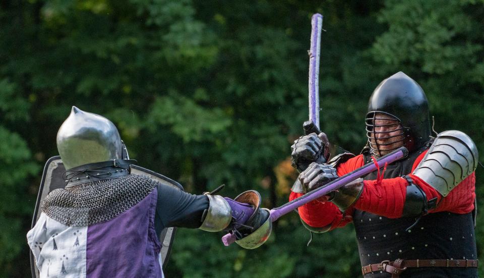 Members of Barony of Sternfeld, Paul Brown, left, and Nathan Jones, do armored combat at Washington Township Park, Tuesday, Aug. 9, 2022 in Avon. The local chapter of the international Society of Creative Anachronism gathers for practice weekly when not off participating in activity around the country. Their SCA names are Paul of Beckenham, and Temak von Atzinger.