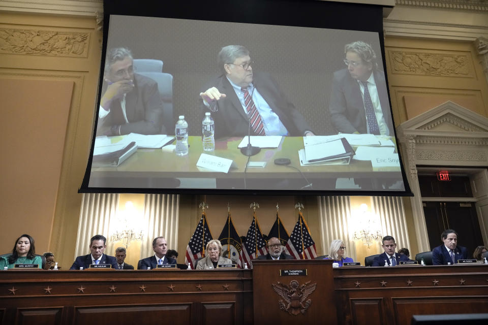 Former Attorney General William Barr is seen on screen 