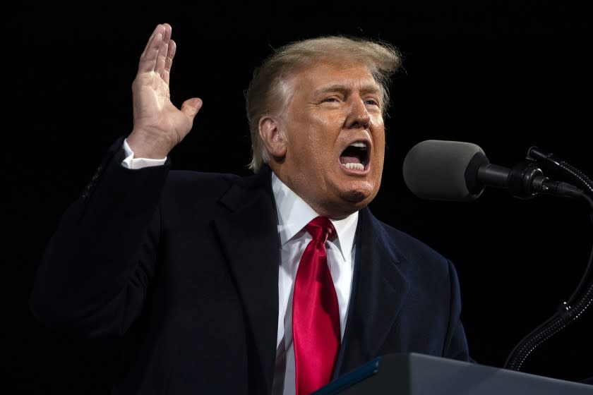 FILE - In this Saturday, Dec. 5, 2020, file photo, President Donald Trump speaks at a campaign rally for Senate Republican candidates Sen. Kelly Loeffler, R-Ga., and Sen. David Perdue, R-Ga., at Valdosta Regional Airport, in Valdosta, Ga. Twin Senate runoffs in Georgia, on Tuesday, Jan. 5, 2021, just 15 days before Trump leaves office, will not only determine which party controls the Senate but also offer the first clues about how long Trump can maintain his grip on the nation's political affairs once he loses the White House megaphone. (AP Photo/Evan Vucci, File)