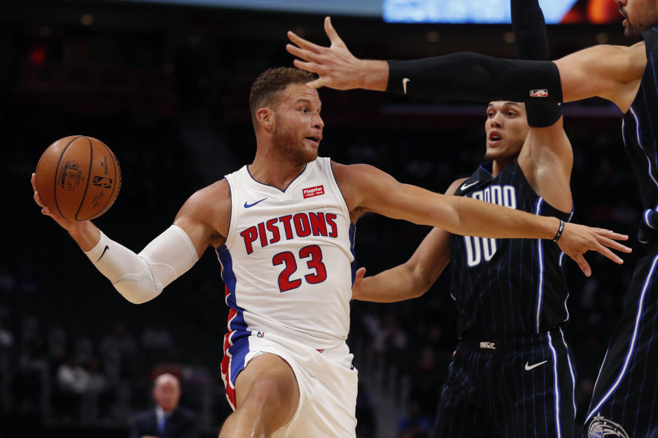 Detroit Pistons forward Blake Griffin (23) passes as Orlando Magic forward Aaron Gordon (00) defends during the first half of an NBA basketball game, Monday, Oct. 7, 2019, in Detroit. (AP Photo/Carlos Osorio)