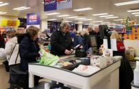 FILE PHOTO: People at an Iceland store in Northwich after opening one hour early