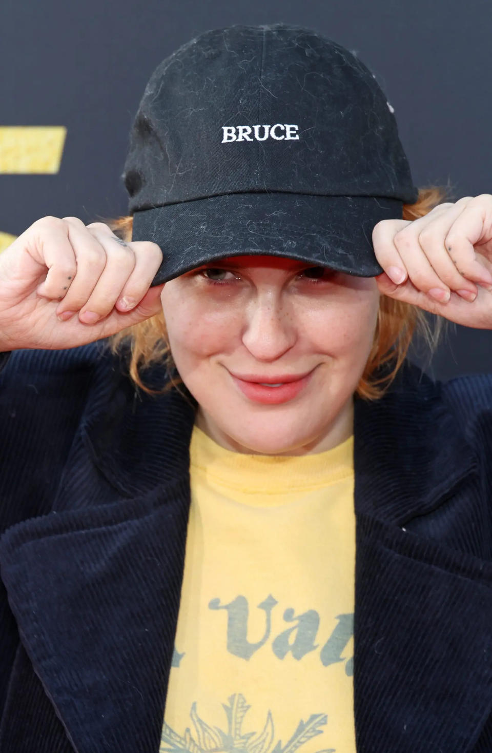 Tallulah Willis wearing a black hat with the name "Bruce" embroidered.