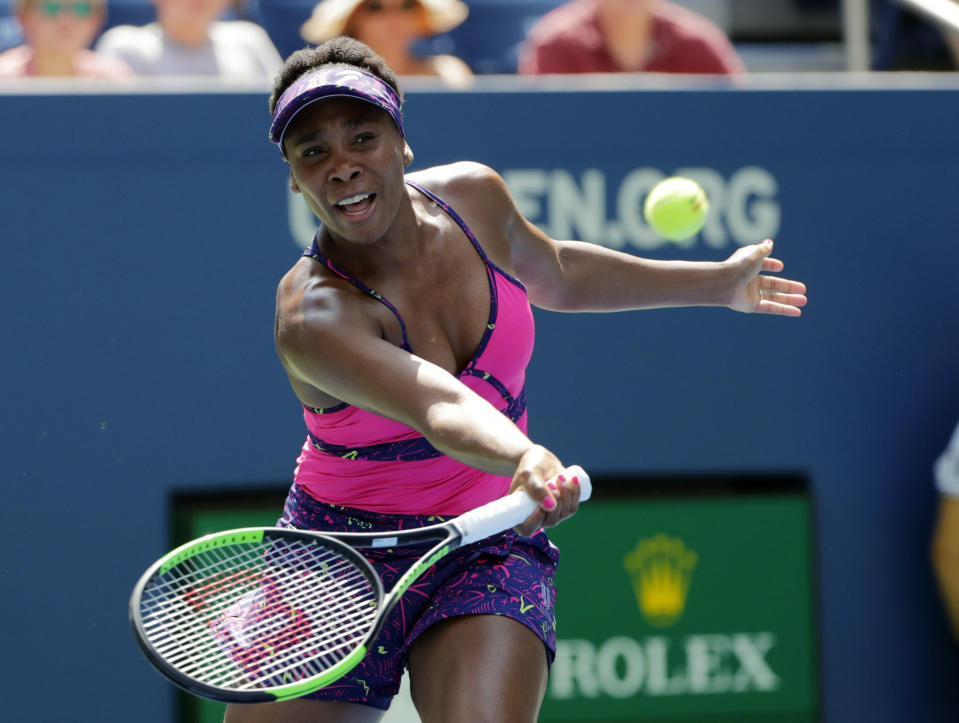 Venus Williams returns a shot to Camila Giorgi, of Italy, during the second round of the U.S. Open tennis tournament, Wednesday, Aug. 29, 2018, in New York. (AP Photo/Frank Franklin II)