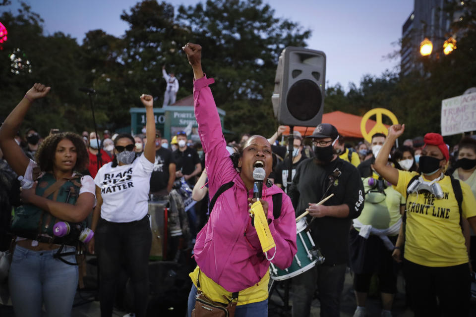 Demonstrators shout slogans during a Black Lives Matter protest Friday, July 24, 2020, in Portland, Ore. (AP Photo/Marcio Jose Sanchez)