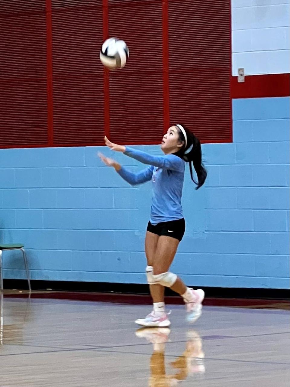 Ridgedale's Hannah Cook serves the volleyball during a home match with Elgin last year.