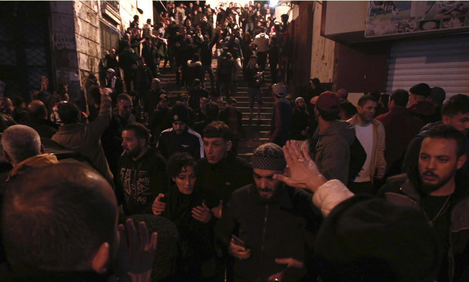 Protesters gather after the presidential elections, Thursday Dec.12, 2019 in Algiers. Algerians — without a leader since April — voted for a new president or boycotted and held street protests against the elections decried by a massive pro-democracy movement that forced former leader Abdelaziz Bouteflika to resign. (AP Photo/Fateh Guidoum)