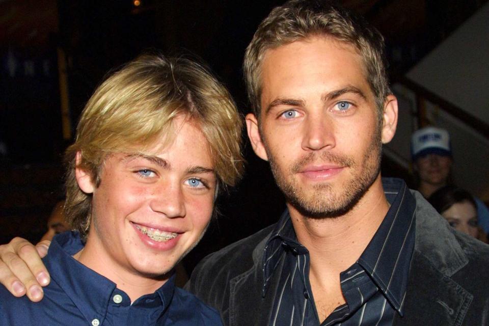 <p>Frederick M. Brown/Getty</p> Paul Walker, right, with his younger brother Cody in 2003.