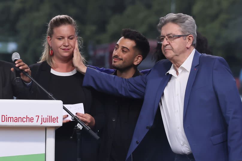 Far-left France Unbowed founder Jean-Luc Melenchon touches Mathilde Panot, former head of his group at the National Assembly in Paris, 7 July 2024