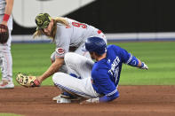 Toronto Blue Jays' Bradley Zimmer, right, slides into second base on a double ahead of the tag by Cincinnati Reds' Taylor Motter during the seventh inning of a baseball game Friday, May 20, 2022, in Toronto. (Jon Blacker/The Canadian Press via AP)