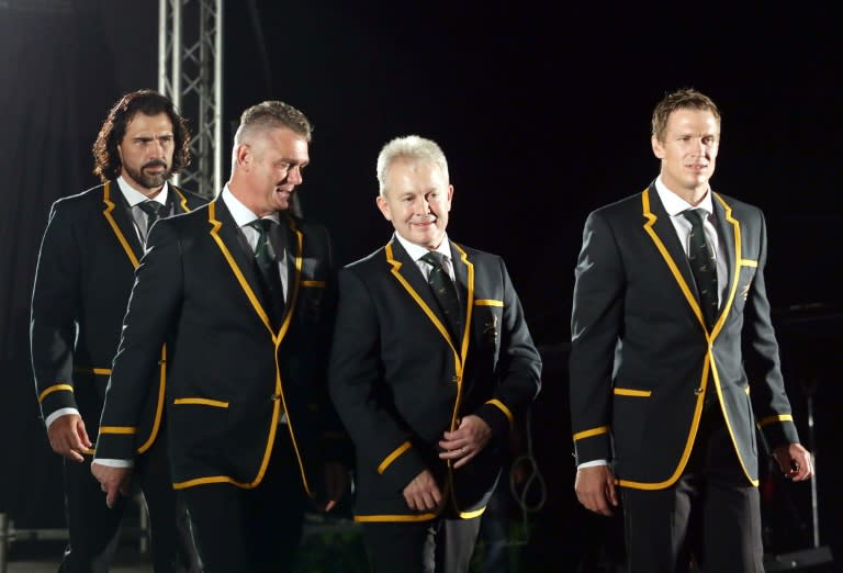 South African coach Heyneke Meyer (L) talks with Manager Ian Schwartz as captain Jean de Villiers (R) and vice captain Victor Matfield (back) look on during the 2015 South Africa Rugby World Cup Squad announcement in Durban on August 28, 2015