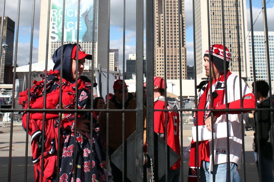 ST LOUIS, MO - OCTOBER 20: Fans await to enter the stadium gates prior to Game Two of the MLB World Series between the Texas Rangers and the St. Louis Cardinals at Busch Stadium on October 20, 2011 in St Louis, Missouri. (Photo by Dilip Vishwanat/Getty Images)