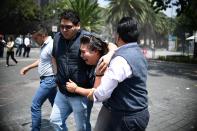<p>People react as a real quake rattles Mexico City on September 19, 2017 as an earthquake drill was being held in the capital. (Photo: Ronaldo Schemidt/AFP/Getty Images) </p>