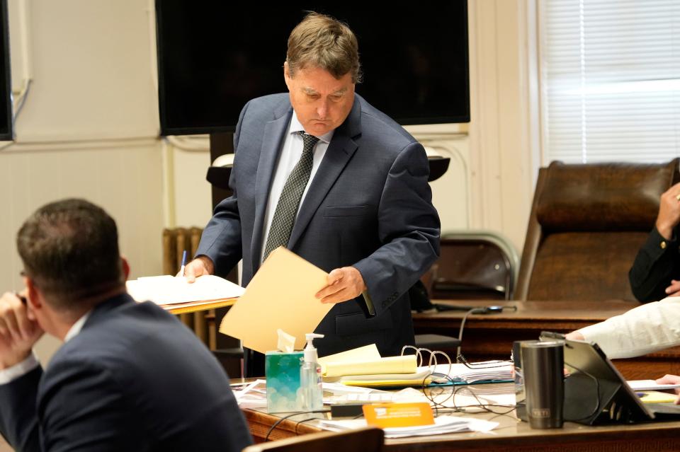 Attorney John P. Parker picks up his files before beginning questioning of Edward ÒJakeÓ Wagner. The trial of George Washington Wagner IV resumes Friday, October 27, 2022 at the Pike County Common Pleas Court in Waverly, Ohio. Eight members of the Rhoden family were found shot to death at four different locations on April 21-22, 2016. 