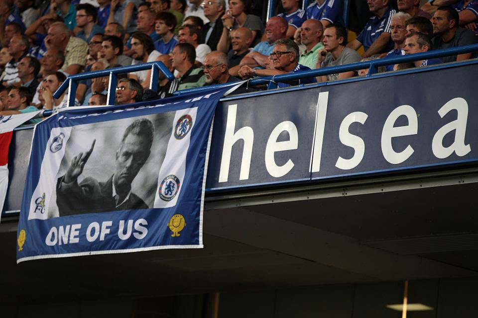 Chelsea fans hang a Jose Mourinho banner from the stands