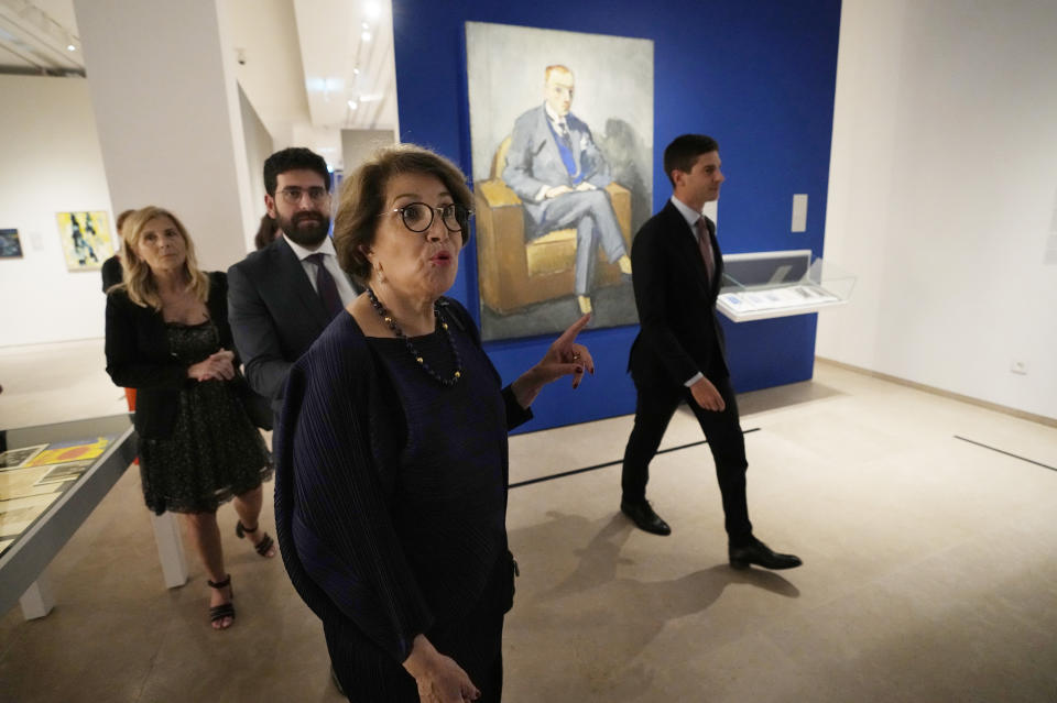 Guests tour the Sursock Museum's exhibitions after relaunching an opening event for the iconic venue in Beirut, Lebanon, Friday, May 26, 2023. The museum has reopened to the public, three years after after a deadly explosion in the nearby Beirut port reduced many of its treasured paintings and collections to ashes. (AP Photo/Hussein Malla)