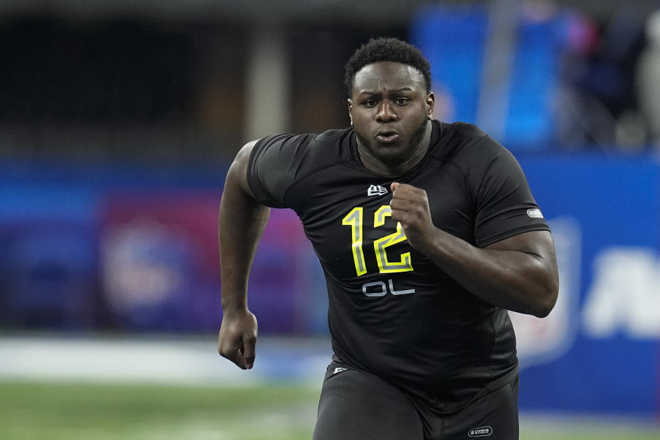 FILE - North Carolina State offensive lineman Ikem "Ickey" Ekwonu runs a drill during the NFL football scouting combine, Friday, March 4, 2022, in Indianapolis. Joe Douglas and the New York Jets enter the NFL draft poised to make franchise history. With picks Nos. 4 and 10, the team has two selections in the top 10 for the first time. (AP Photo/Darron Cummings, File)