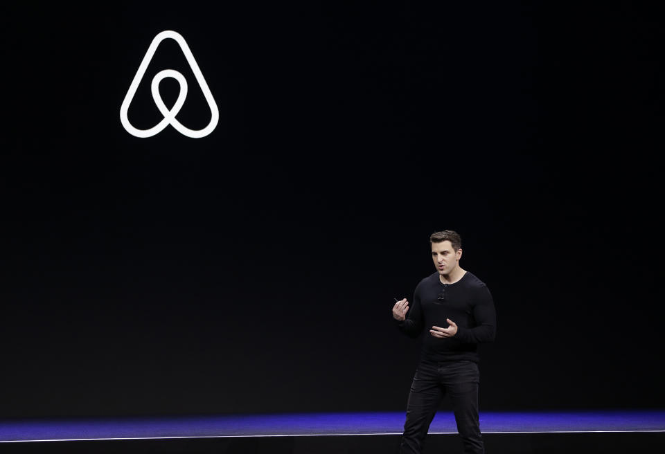 FILE - In this Feb. 22, 2018, file photo Airbnb co-founder and CEO Brian Chesky speaks during an event in San Francisco. Just as the coronavirus outbreak has boxed in society, it’s also squeezed high-flying tech companies reliant on people’s freedom to move around and get together. Airbnb, which just weeks ago was planning for a bombshell initial public offering, is reportedly shedding millions of dollars and facing harsh blowback from hosts who relied on its platform for income. (AP Photo/Eric Risberg, File)