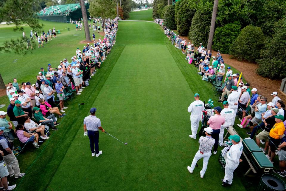 Bryson DeChambeau lines up his tee shot on the 18th hole.