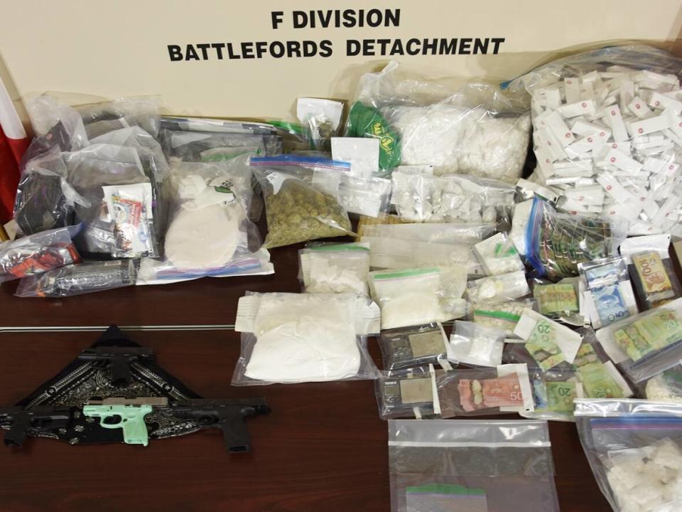 In all, officers seized nearly eight kilograms of the suspected cocaine, 281 grams of Xanax tablets, more than 5,000 pre-rolled cannabis joints, 898 cartons of contraband cigarettes, more than 10 kilograms of clippings, a large sum of cash and four illegally owned handguns, the agent says Police.  (Battleford RCMP - photo credit)